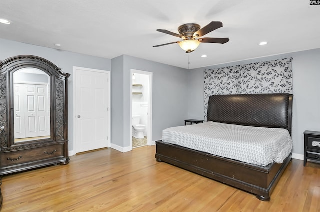 bedroom with ceiling fan, wood-type flooring, and connected bathroom