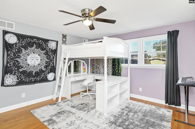 bedroom featuring light hardwood / wood-style floors and ceiling fan