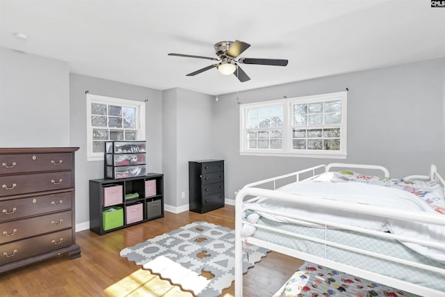 bedroom featuring ceiling fan and light hardwood / wood-style floors