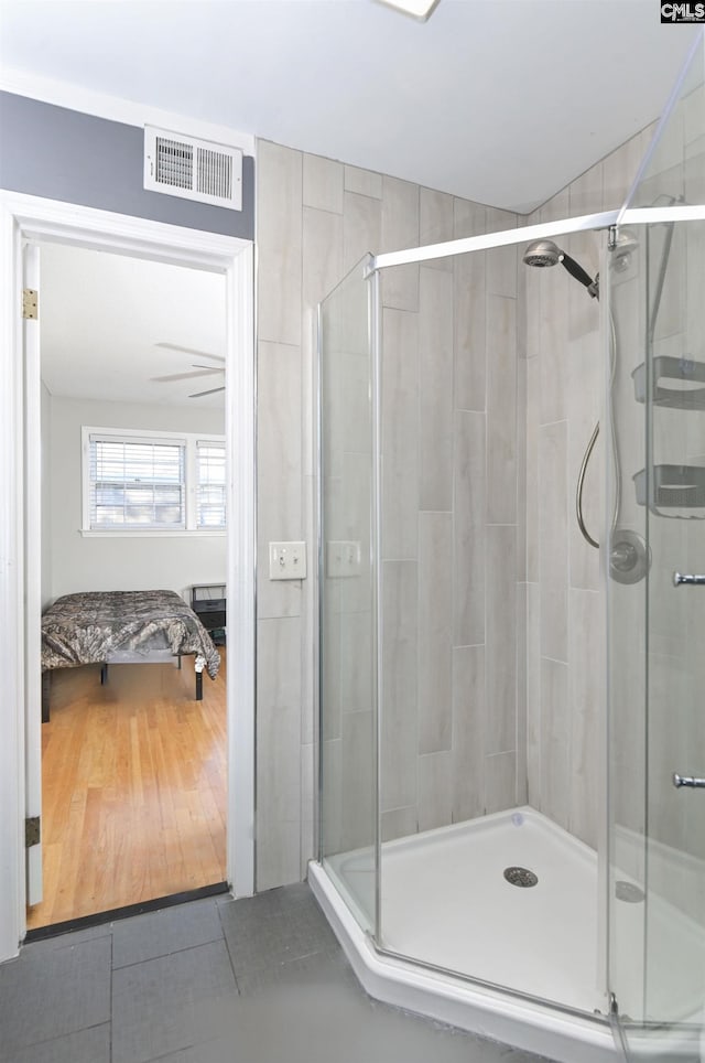 bathroom featuring tile patterned flooring and walk in shower