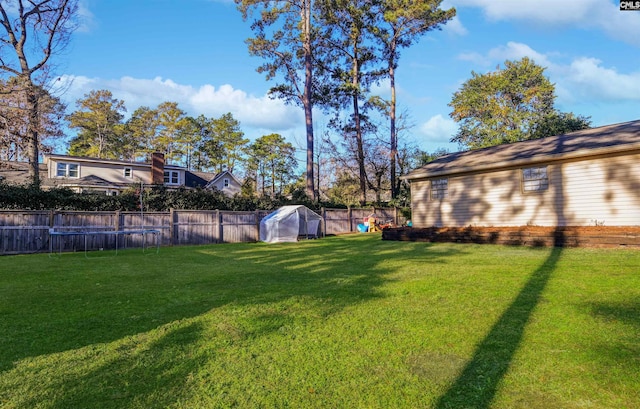 view of yard with a trampoline