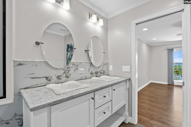 143 Yachting Cir, Lexington, SC 29072 - bathroom featuring ornamental molding, double vanity, backsplash, wood finished floors, and baseboards