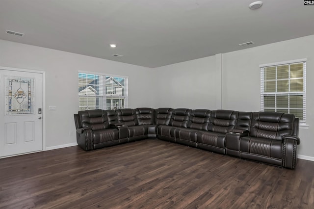 living room featuring dark wood-type flooring