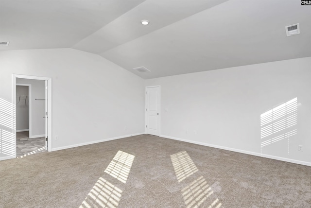 interior space featuring carpet and lofted ceiling