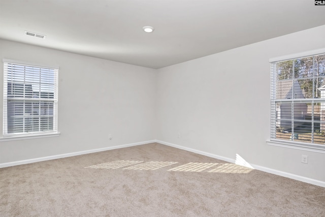 unfurnished room featuring carpet floors