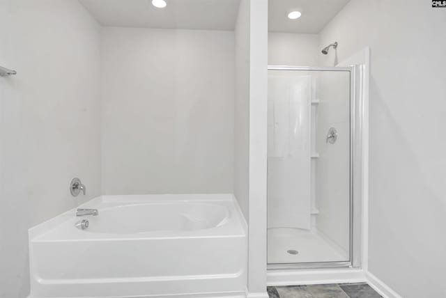 bathroom featuring plus walk in shower