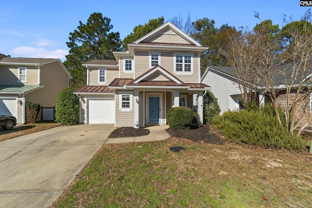 view of front of property featuring a front yard and a garage