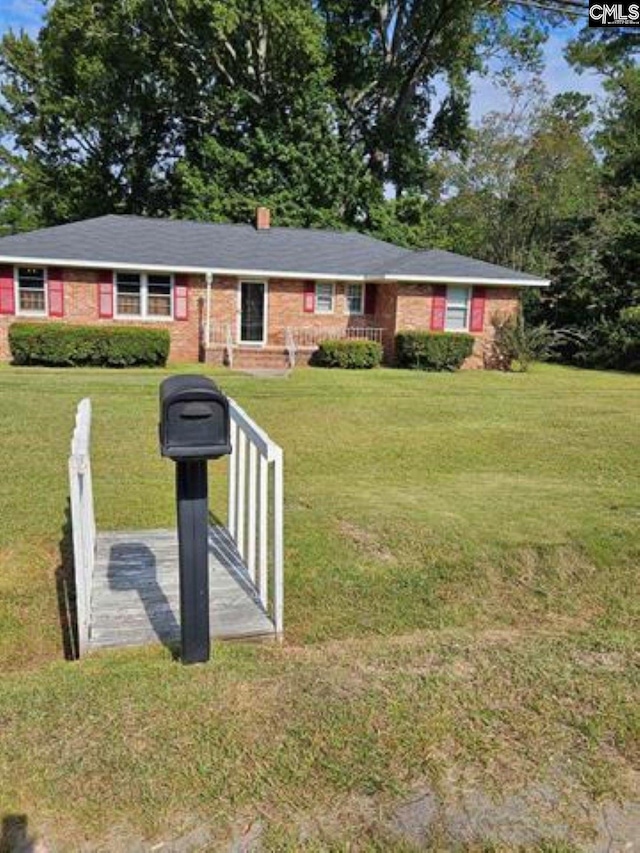 ranch-style house with a front yard