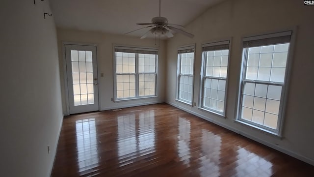 unfurnished sunroom featuring plenty of natural light, lofted ceiling, and ceiling fan