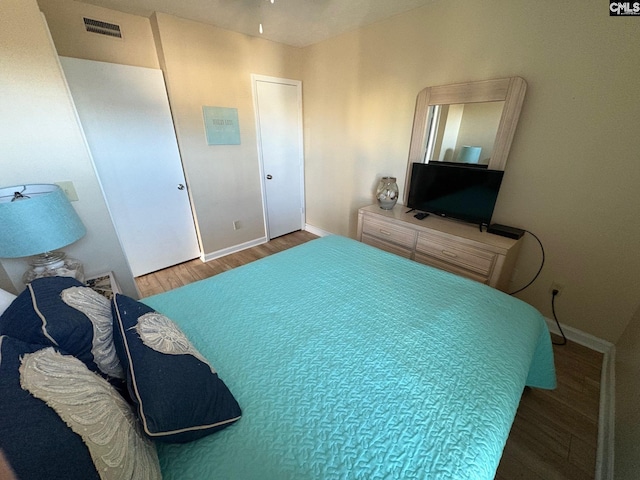 bedroom featuring hardwood / wood-style floors