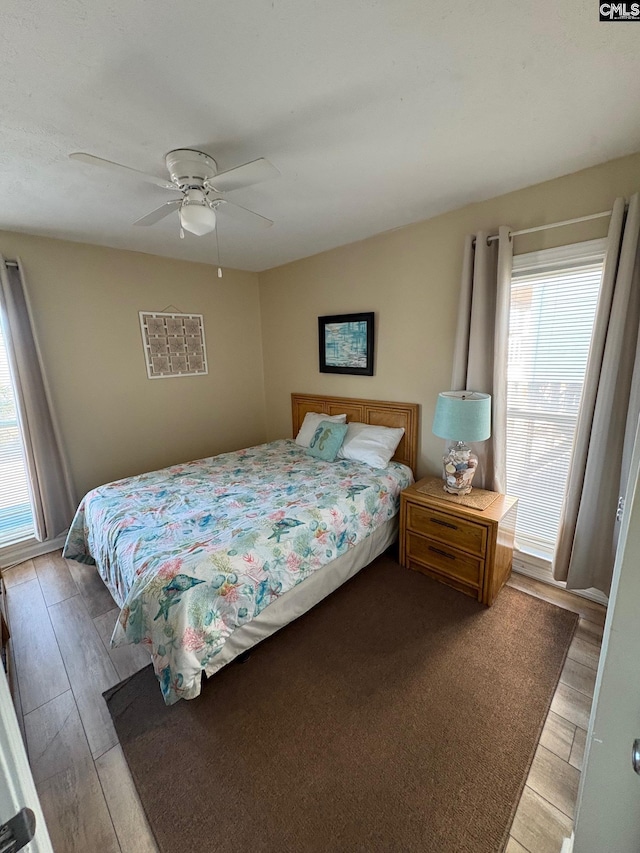 bedroom featuring light hardwood / wood-style flooring and ceiling fan