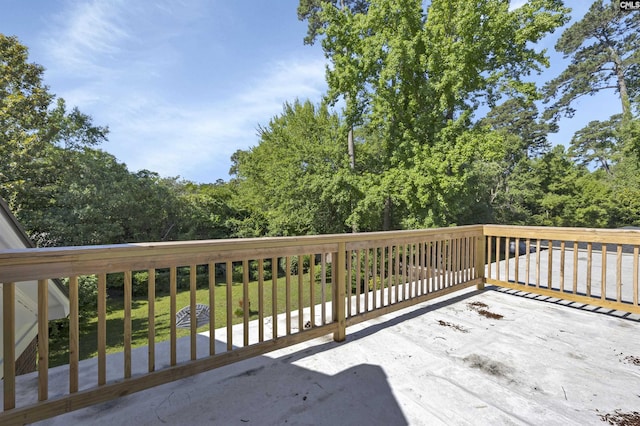 wooden deck featuring a yard