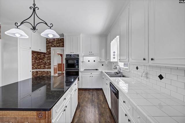 kitchen with backsplash, tile countertops, dishwasher, white cabinets, and hanging light fixtures