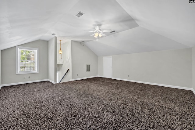 additional living space featuring carpet, vaulted ceiling, and ceiling fan