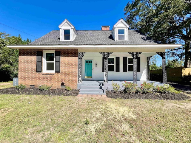 view of front of home with covered porch and a front yard