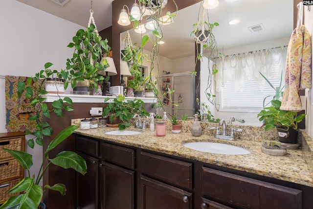 bathroom featuring vanity and walk in shower