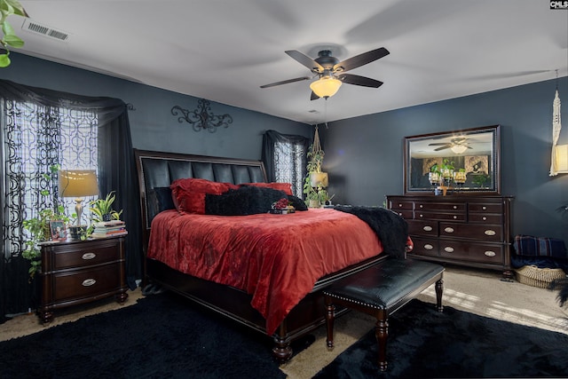 bedroom with ceiling fan and carpet