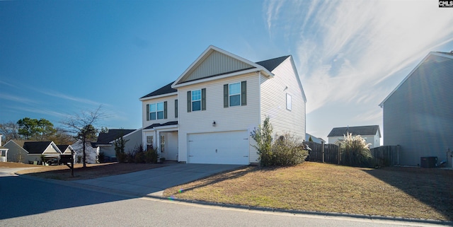 front facade featuring a front lawn, a garage, and central AC