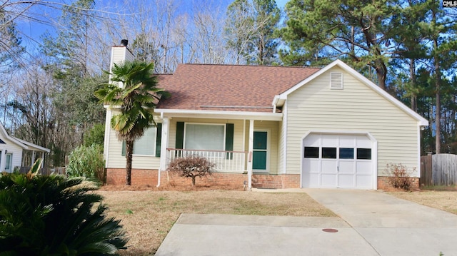 single story home featuring a porch and a garage