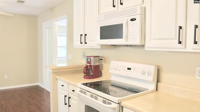 kitchen featuring white appliances, baseboards, dark wood-style flooring, light countertops, and white cabinetry