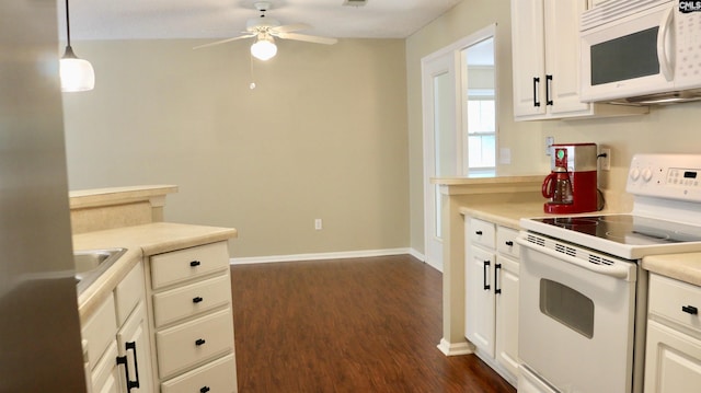 kitchen with ceiling fan, white appliances, dark wood-style flooring, baseboards, and light countertops