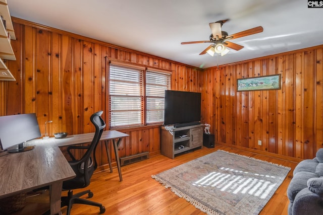 home office with ceiling fan, light hardwood / wood-style flooring, and ornamental molding