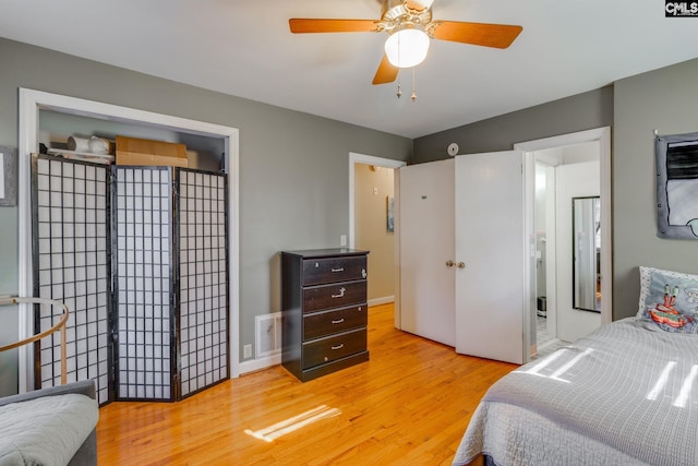 bedroom with ceiling fan and light hardwood / wood-style floors