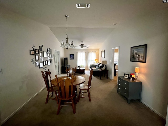 dining room featuring carpet, ceiling fan with notable chandelier, and lofted ceiling