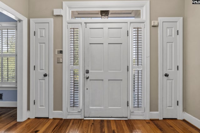 entryway with hardwood / wood-style floors