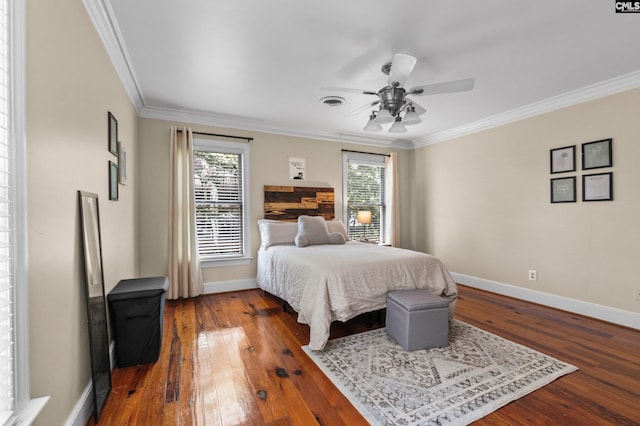 bedroom featuring ceiling fan, wood-type flooring, and crown molding