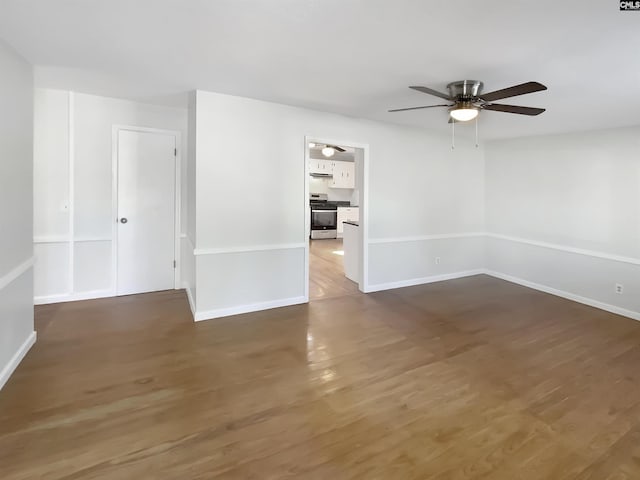 unfurnished room featuring dark hardwood / wood-style flooring and ceiling fan