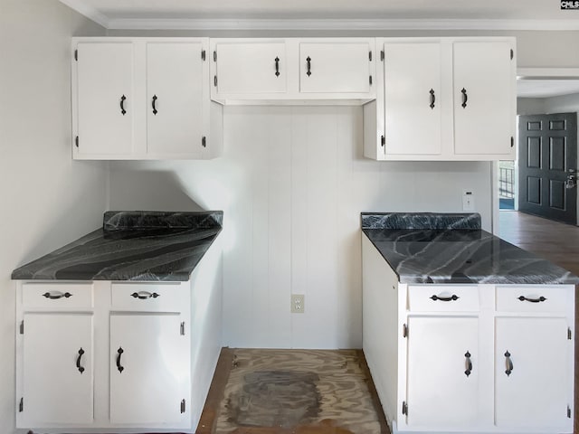 kitchen with white cabinets and crown molding