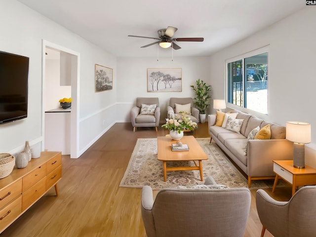 living room with hardwood / wood-style floors and ceiling fan