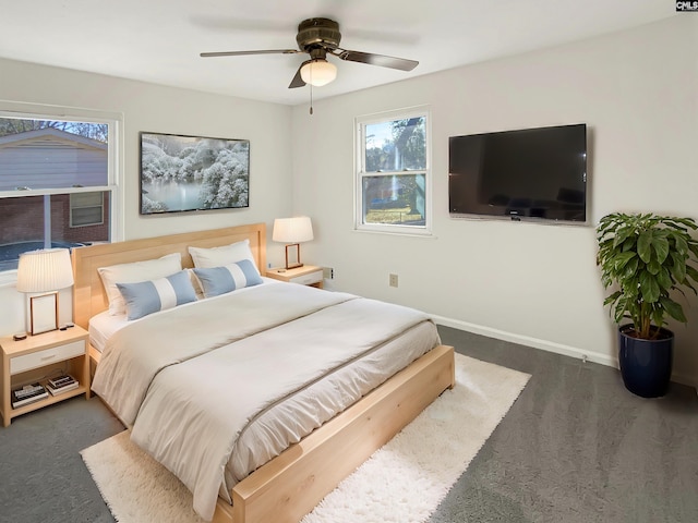 bedroom with dark colored carpet and ceiling fan