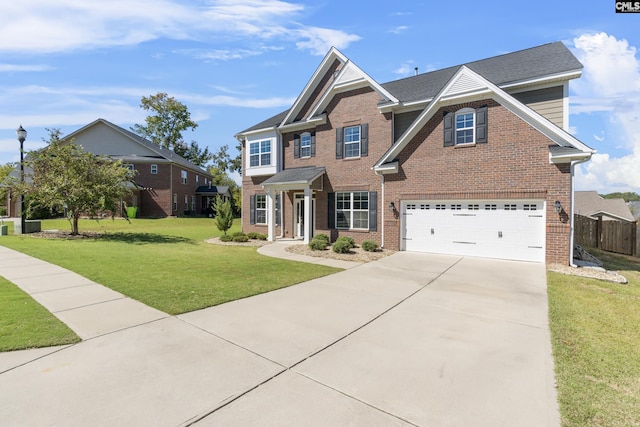 view of front of home featuring a garage and a front lawn