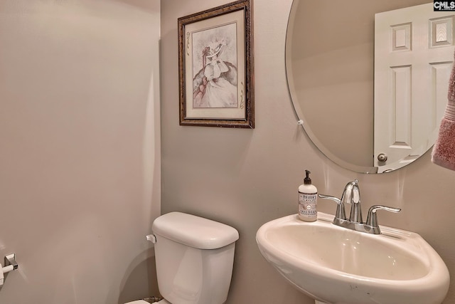 bathroom with sink and toilet