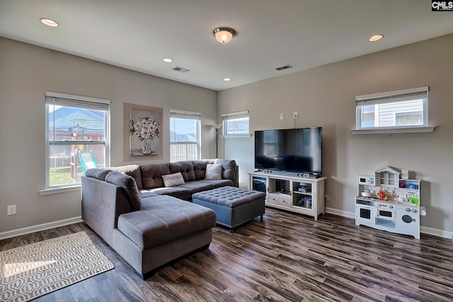 living room with dark hardwood / wood-style flooring