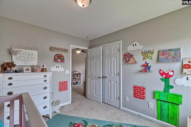 bedroom with a closet and light colored carpet