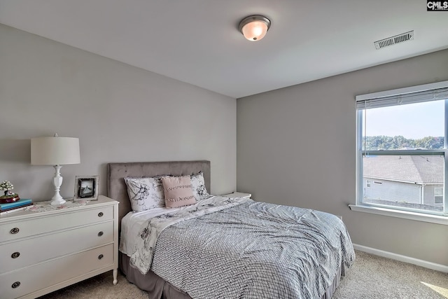 bedroom with light carpet