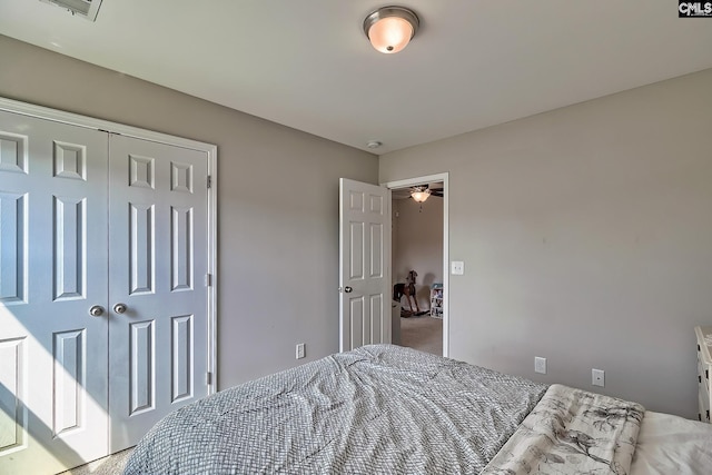 bedroom with a closet and carpet