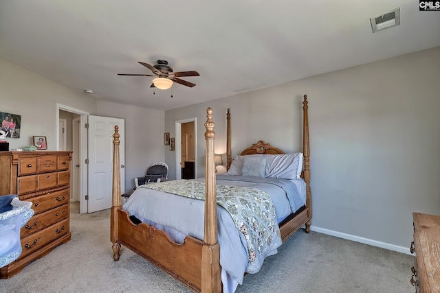 bedroom featuring light colored carpet and ceiling fan