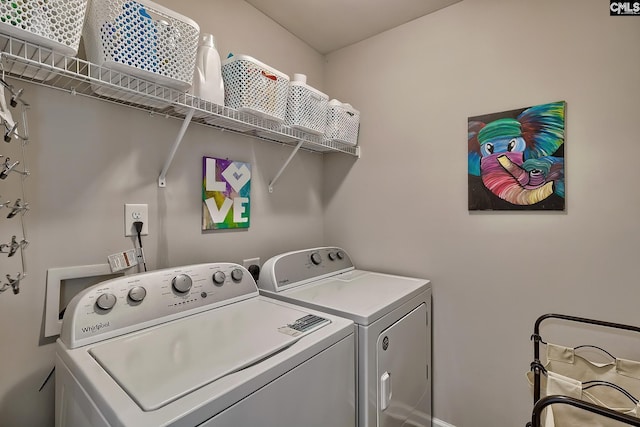 laundry area with washing machine and dryer