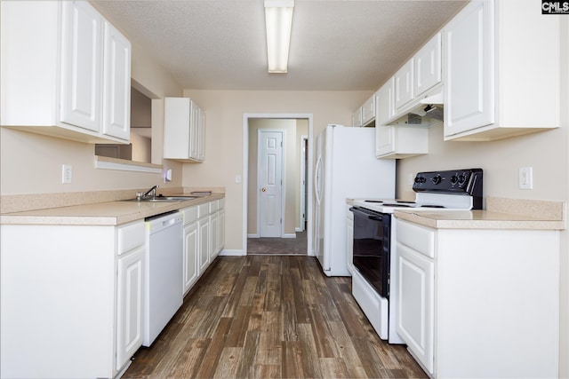 kitchen with white appliances, white cabinets, custom exhaust hood, and dark hardwood / wood-style flooring