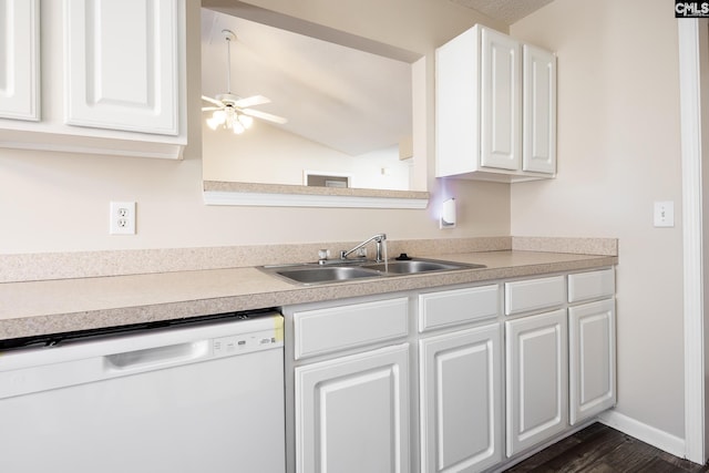 kitchen with white dishwasher, ceiling fan, white cabinets, and sink