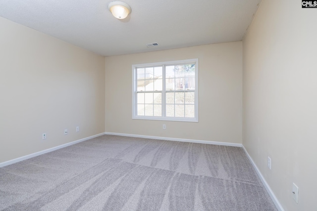 unfurnished room featuring carpet floors