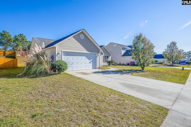 ranch-style house featuring a front yard and a garage