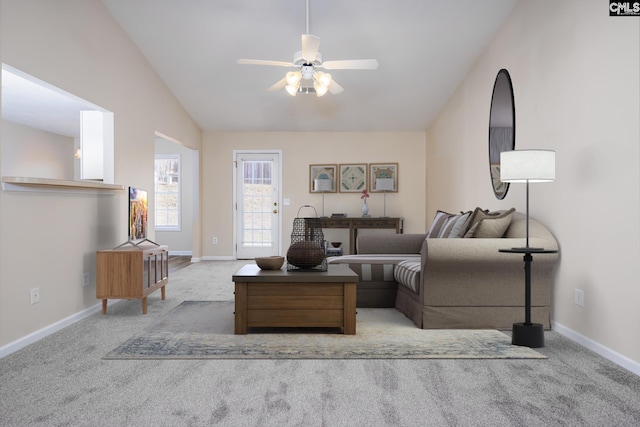 carpeted living room with lofted ceiling and ceiling fan