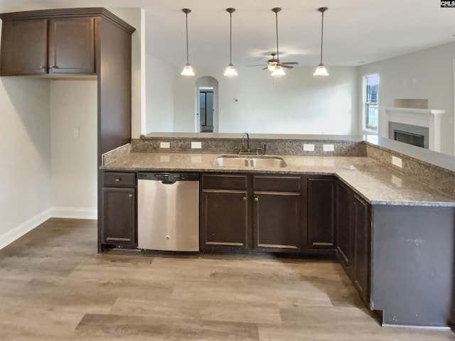 kitchen with dishwasher, pendant lighting, ceiling fan, and sink