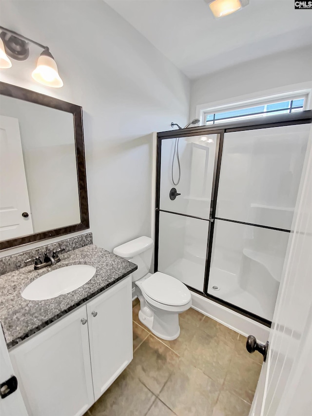 508 Compass Rose Way, Irmo, SC 29063 - full bath featuring vanity, toilet, an enclosed shower, and tile patterned flooring