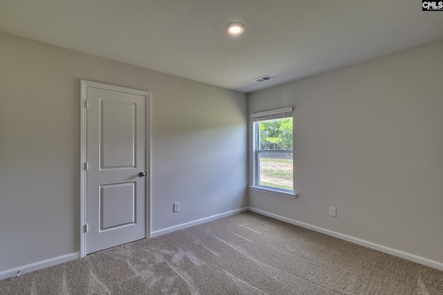 view of carpeted spare room